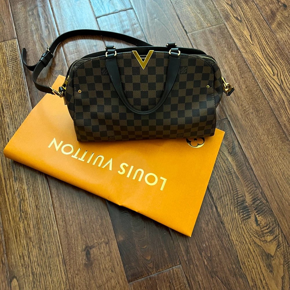 Like New Louis Vuitton, with purchase receipt